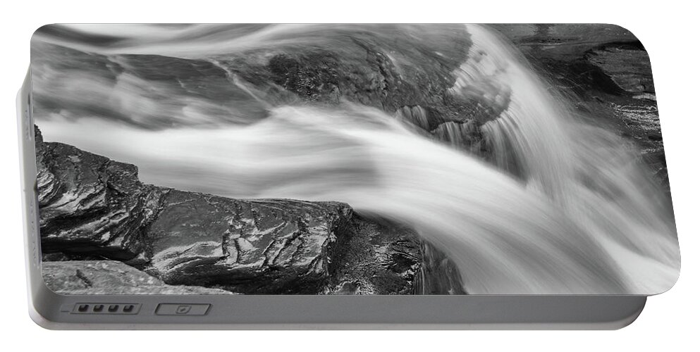 Abstract Portable Battery Charger featuring the photograph Black and White Rushing Water by Louis Dallara