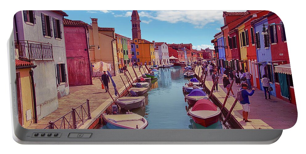 Brightly Portable Battery Charger featuring the photograph Brightly painted houses and small boats in canal by Steve Estvanik
