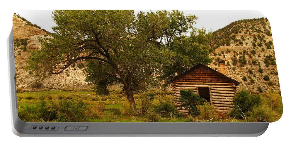 Cabin Portable Battery Charger featuring the photograph Cabin next to a tree by Jeff Swan