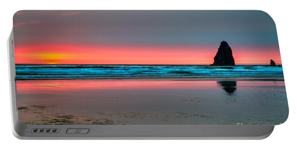 Sunset Portable Battery Charger featuring the photograph Cannon Beach Sunset with a smokey hazy sky by Bruce Block