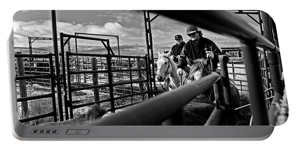 Ranch Portable Battery Charger featuring the photograph Cowboys at work by Julieta Belmont