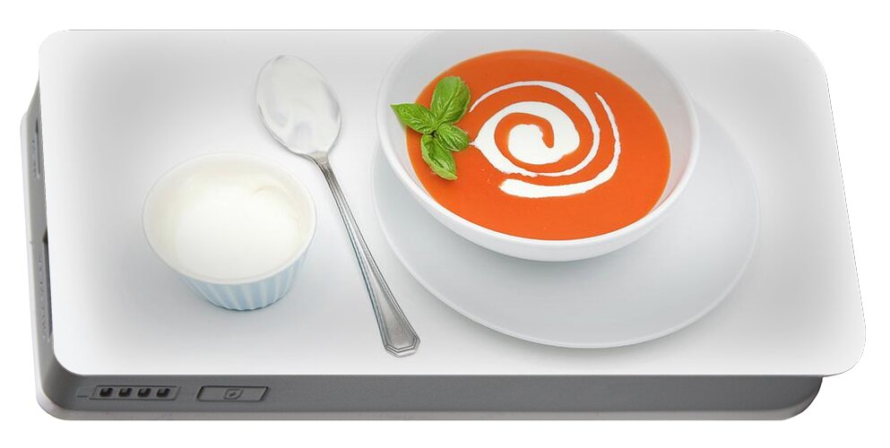 Ip_11280341 Portable Battery Charger featuring the photograph Cream Of Tomato Soup With Sour Cream And Basil by Michael Wissing