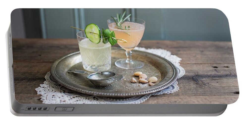Ip_11376366 Portable Battery Charger featuring the photograph Cucumber Lemonade And Gin & Tonic With Grapefruit And Rosemary by Anne Faber