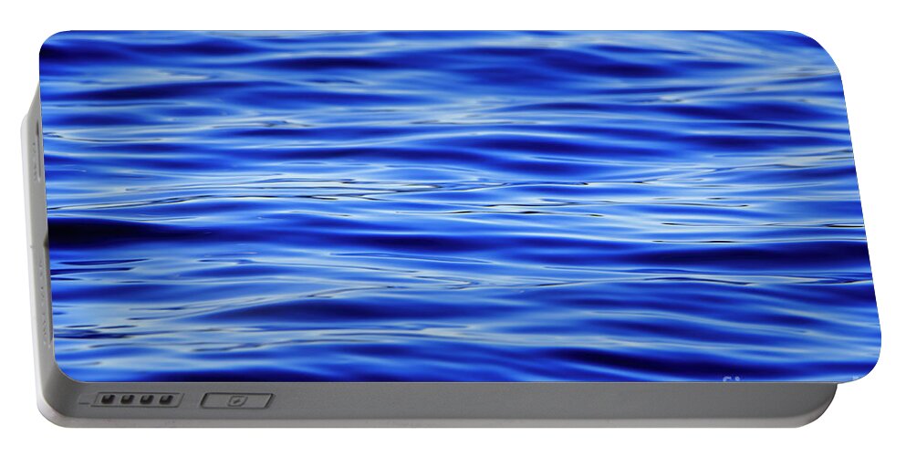 Blue Portable Battery Charger featuring the photograph Dark Blue Water Ripples Background by Sandra J's