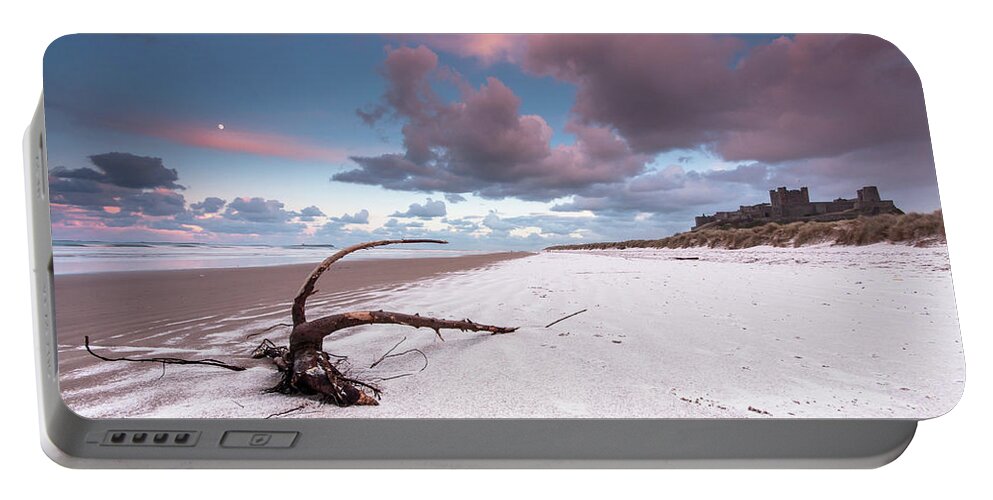 Landscape Portable Battery Charger featuring the photograph Fairy Tale Castle with snow on the beach by Anita Nicholson
