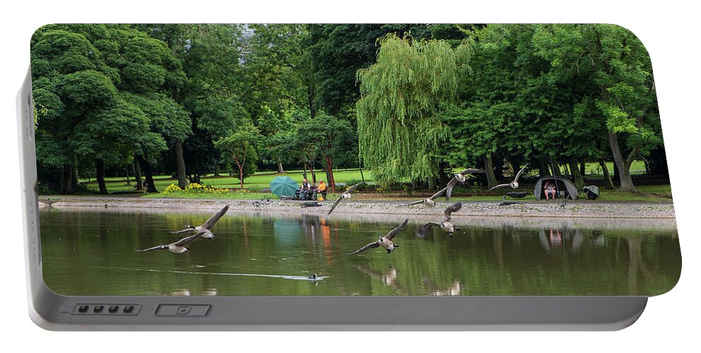 Bird Portable Battery Charger featuring the photograph Flying Geese by Iordanis Pallikaras
