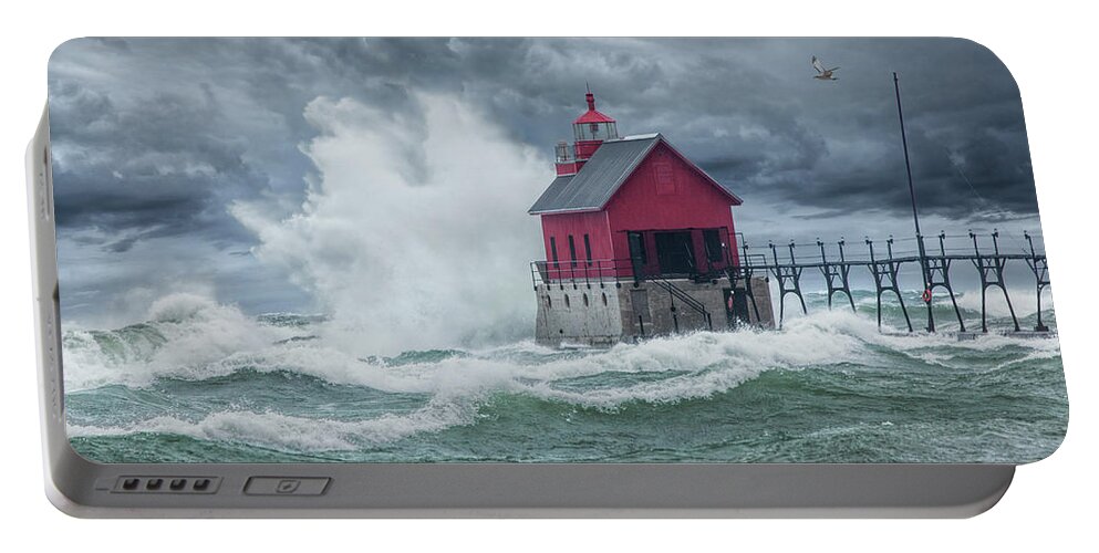 Lighthouse Portable Battery Charger featuring the photograph Grand Haven Lighthouse on Lake Michigan in a November Storm by Randall Nyhof