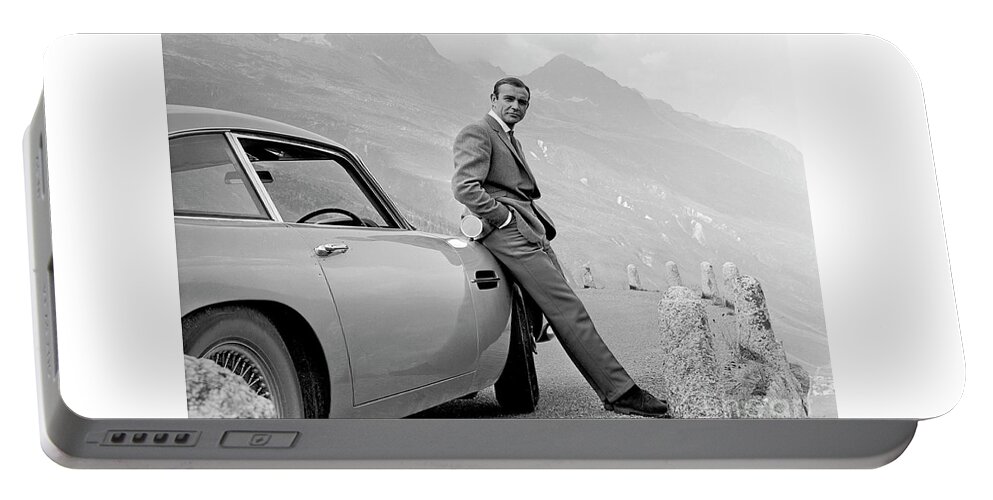 James Bond Portable Battery Charger featuring the photograph James Bond Coolly Leaning on His Aston Martin by Doc Braham