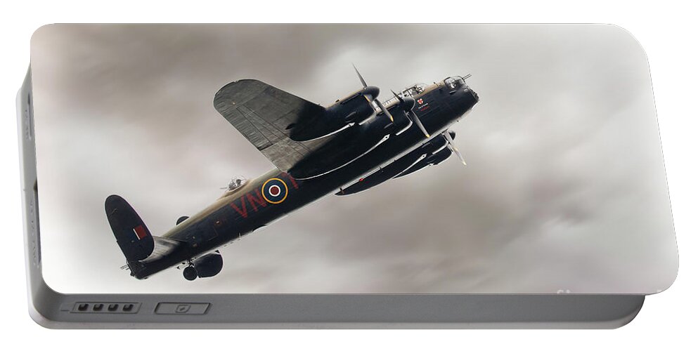 Aviation Portable Battery Charger featuring the photograph Lancaster bomber close up fly past by Simon Bratt