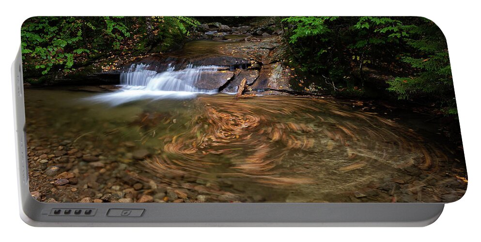 Swirl Portable Battery Charger featuring the photograph Leaf Swirl at a Small Cascade in Franconia Notch State Park II by William Dickman