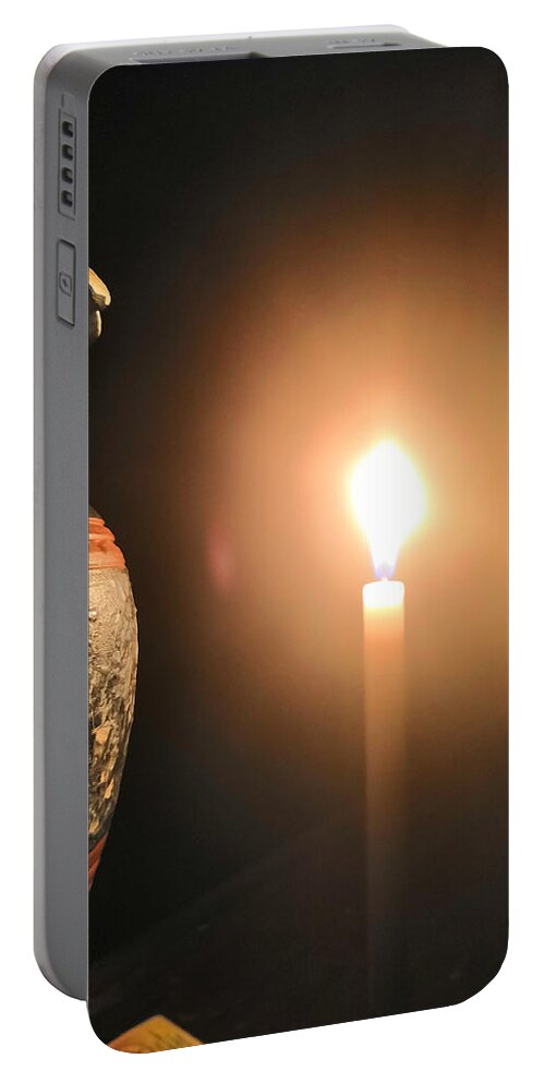 Candle Light Portable Battery Charger featuring the photograph Light in the dark by Ian Batanda