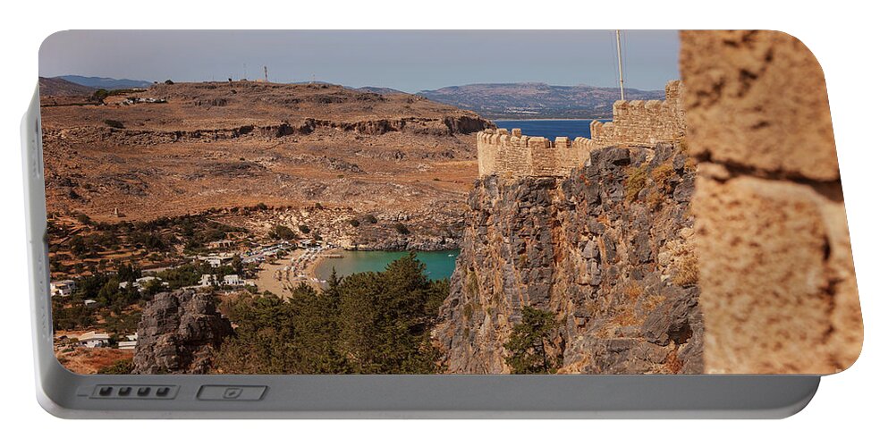Hill Portable Battery Charger featuring the photograph Lindos town and fortress by Sophie McAulay