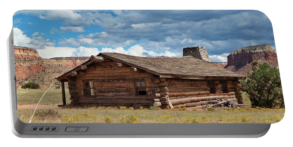 Abiquiu Portable Battery Charger featuring the photograph Log cabin at Ghost Ranch, Abiquiu NM by Segura Shaw Photography