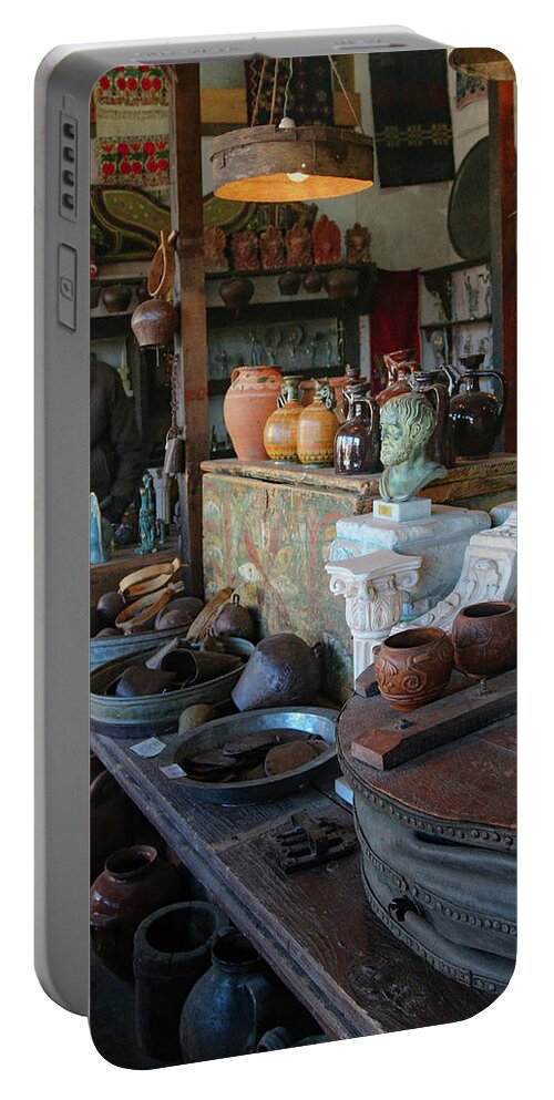 Greece Portable Battery Charger featuring the photograph Man in Shop in Delphi by M Kathleen Warren