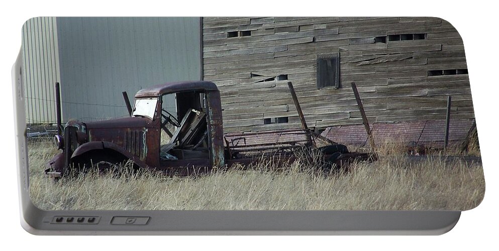 Old Truck Portable Battery Charger featuring the photograph Old Truck and Tower by Julie Rauscher