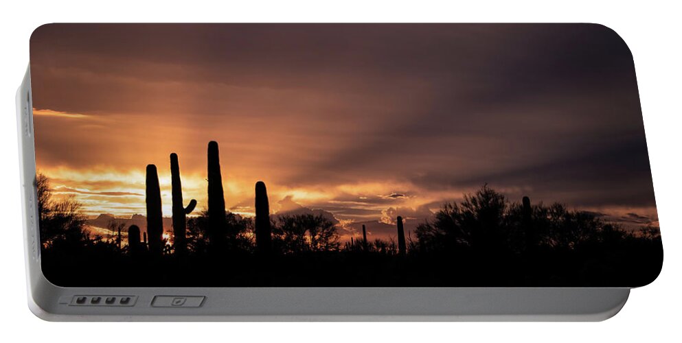 Sun Portable Battery Charger featuring the photograph Old West Sunset by Elaine Malott