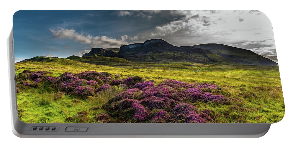 Abandoned Portable Battery Charger featuring the photograph Pasture With Blooming Heather In Scenic Mountain Landscape At The Old Man Of Storr Formation On The by Andreas Berthold