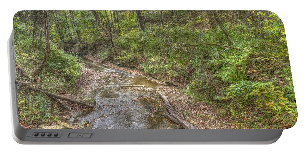 River Portable Battery Charger featuring the photograph River flowing through Pine Quarry Park by Jeremy Lankford