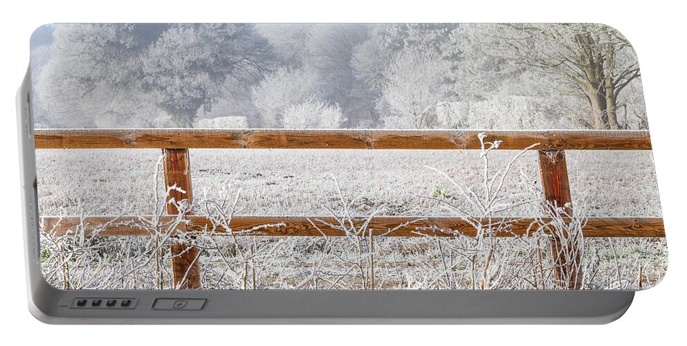 Landscape Portable Battery Charger featuring the photograph Rural winter snow scene and fence by Simon Bratt