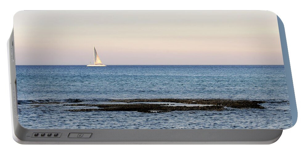 Sea Portable Battery Charger featuring the photograph Sailing boat in the Calm Ocean by Michalakis Ppalis