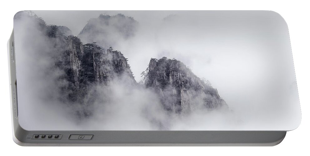 Asia Portable Battery Charger featuring the photograph Shrouded in mist. by Usha Peddamatham