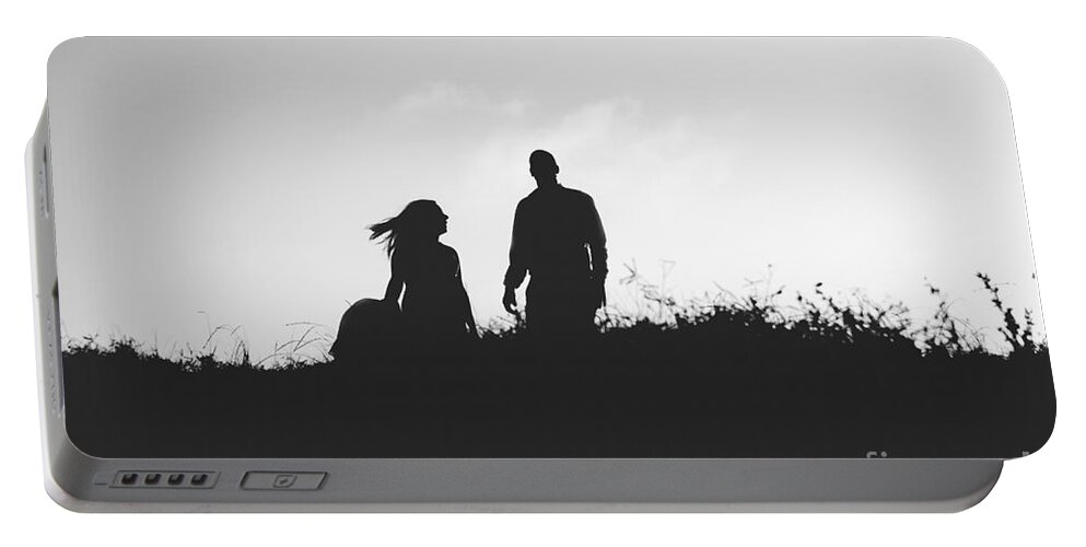 Abstract Portable Battery Charger featuring the photograph Silhouette of couple in love with wedding couple on top of a hil by Joaquin Corbalan