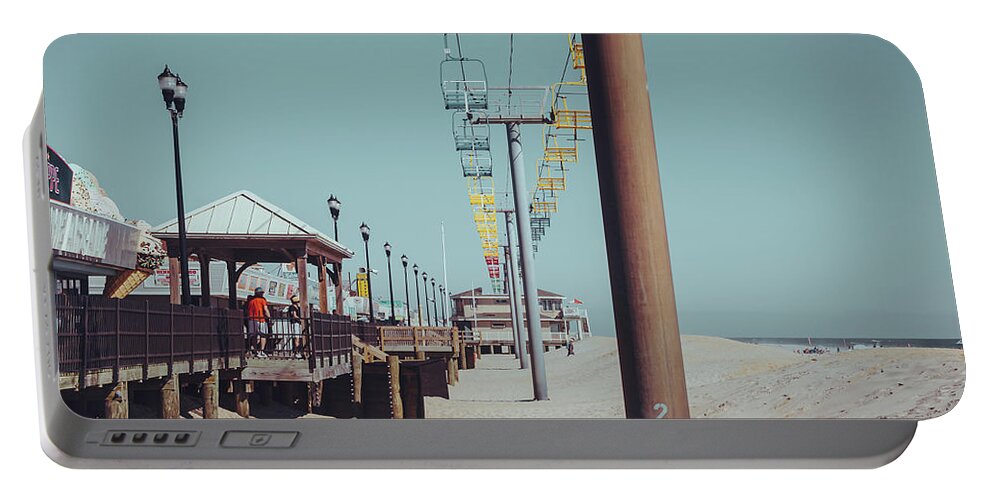 Seaside Portable Battery Charger featuring the photograph Sky Ride by Steve Stanger