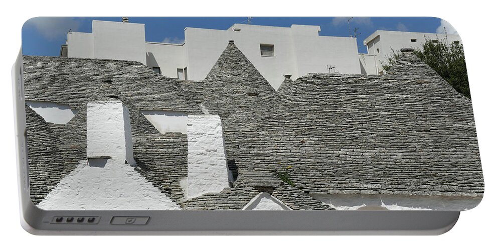 Alberobello Portable Battery Charger featuring the photograph Stone coned rooves of trulli houses by Steve Estvanik