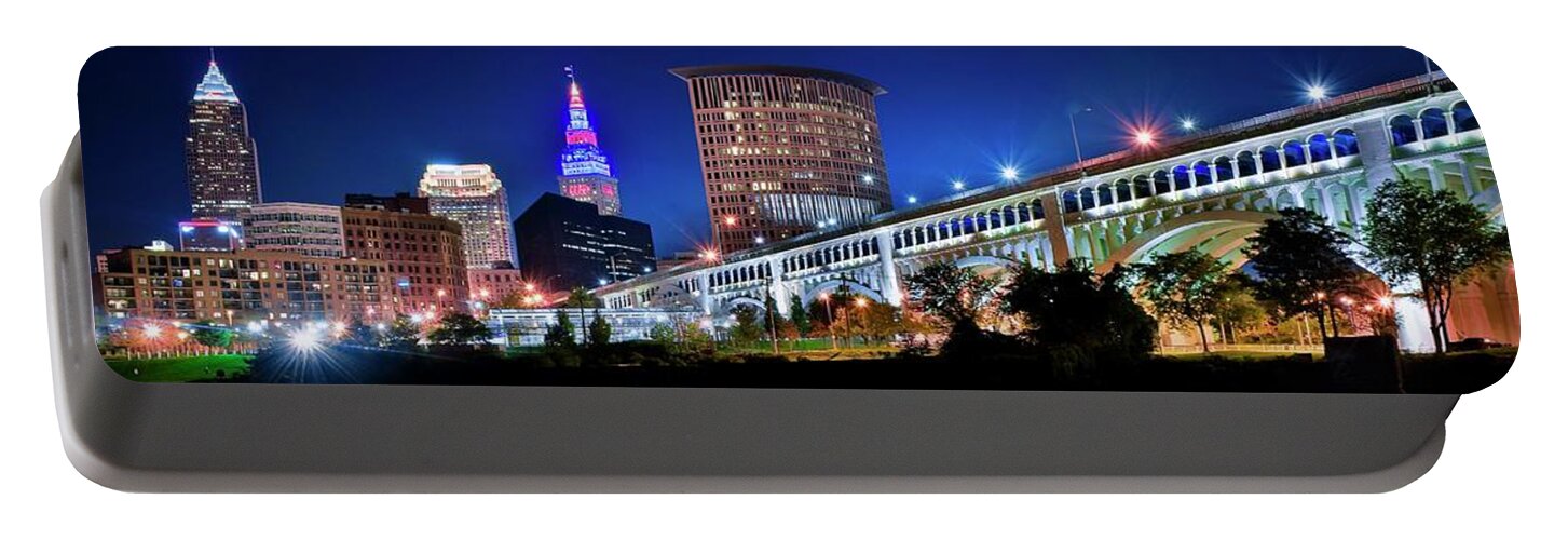 Cleveland Portable Battery Charger featuring the photograph Stretching out on a Colorful Night by Frozen in Time Fine Art Photography