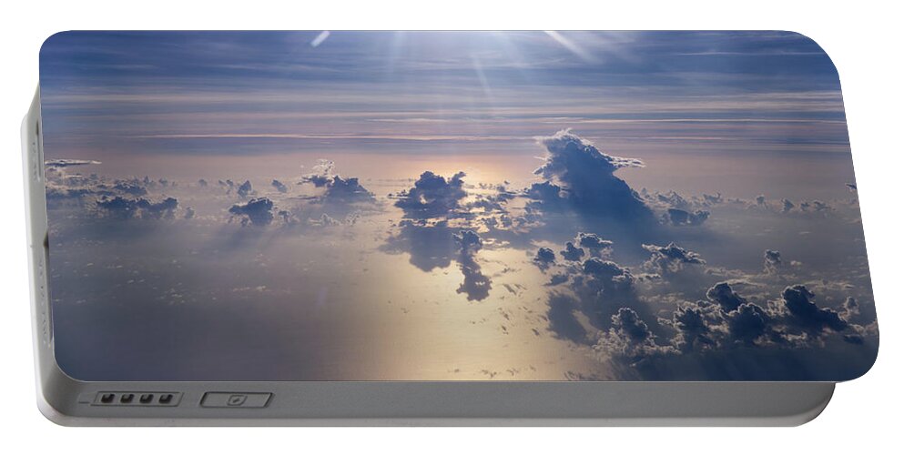 Clouds Portable Battery Charger featuring the photograph Sunburst over the sea by Eric Hafner