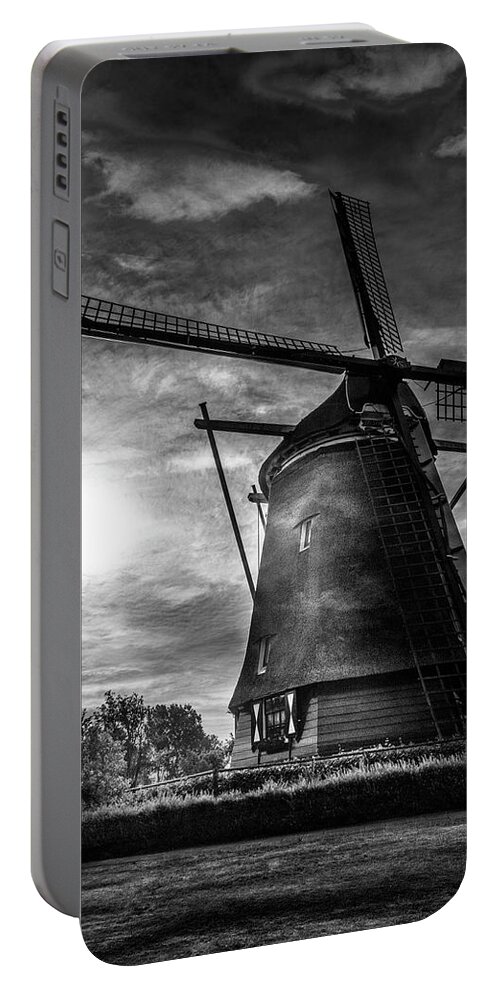 Clouds Portable Battery Charger featuring the photograph Sundown over Holland in Black and White by Debra and Dave Vanderlaan