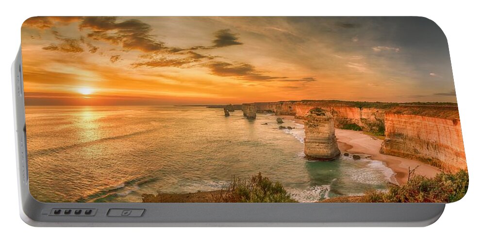 12apostles Portable Battery Charger featuring the photograph Sunset at The Twelve Apostles by Chris Cousins