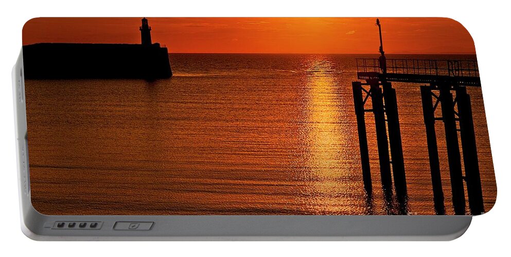 Seascape Portable Battery Charger featuring the photograph Sunset over the sea by Martyn Arnold