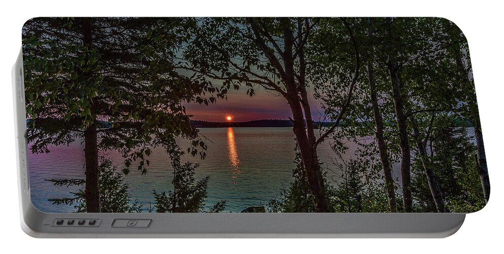 Sunset Portable Battery Charger featuring the photograph Sunset through the trees by Joe Holley