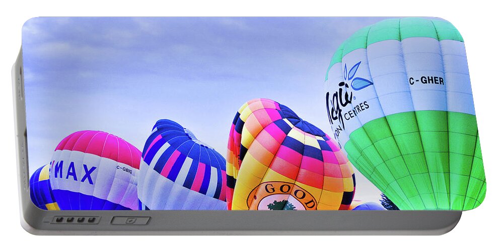 Alberta Portable Battery Charger featuring the photograph The balloons on the ground by Nick Mares