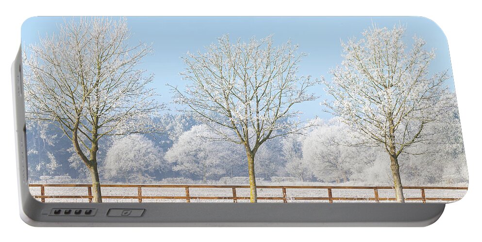 Landscape Portable Battery Charger featuring the photograph Three winter trees and frozen fence by Simon Bratt