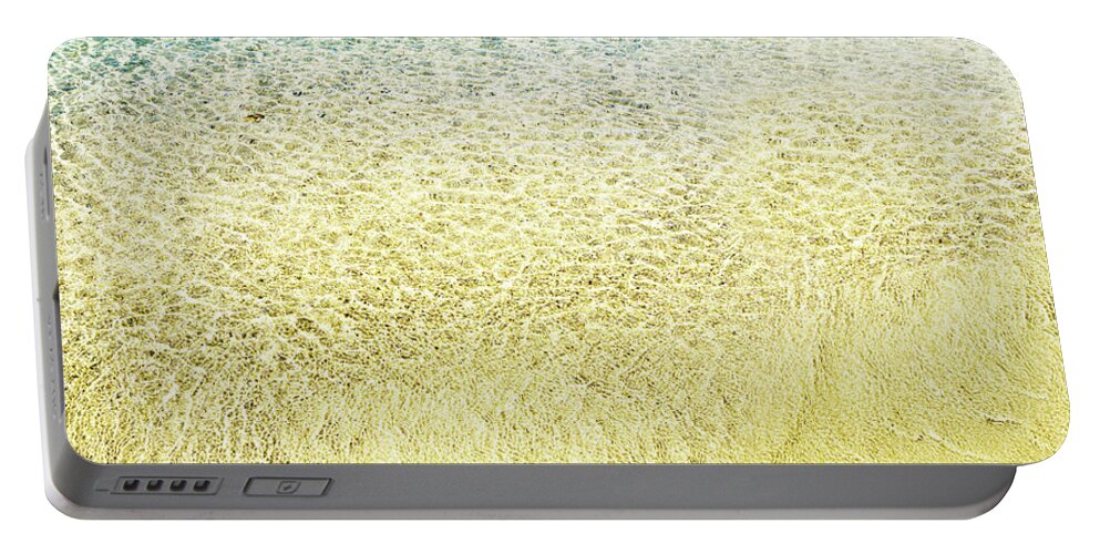 Sea Portable Battery Charger featuring the photograph Top view of sea water and sand texture image. by Jelena Jovanovic