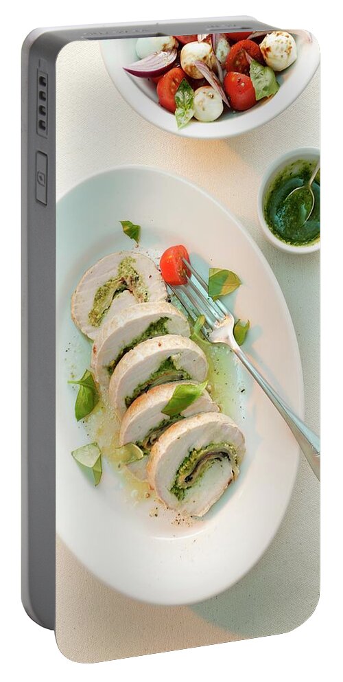 Ip_11284653 Portable Battery Charger featuring the photograph Turkey Roulade With Ham And A Herb Pesto Served With A Tomato And Mozzarella Salad by Michael Wissing