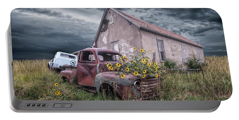 Art Portable Battery Charger featuring the photograph Vintage Ford Truck with Yellow Flowers abandoned on the prairie by Randall Nyhof
