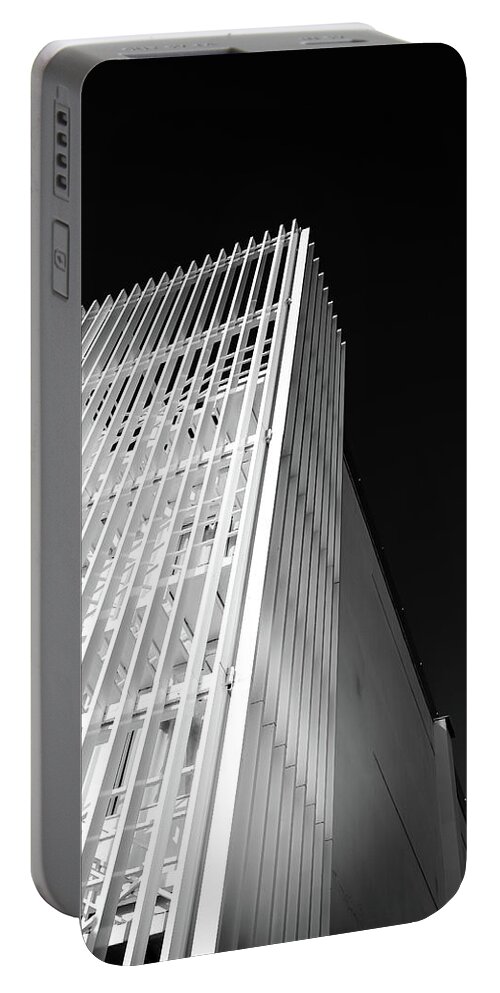 Architecture Portable Battery Charger featuring the photograph Abstract architecture design. Black and white futuristic exterior background. Black sky copy-space by Michalakis Ppalis