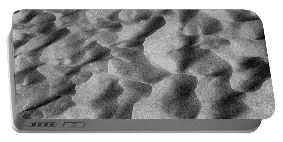 Desert Portable Battery Charger featuring the photograph Abstract sand patterns in the desert #1 by Alessandra RC