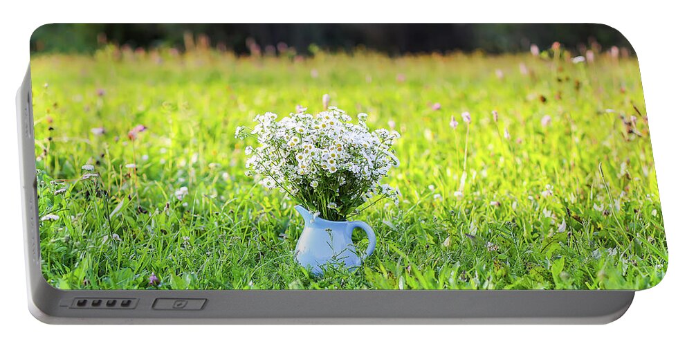Flower Portable Battery Charger featuring the photograph Bouquet of small white daisy flowers in a blue ceramic vase #1 by Olga Strogonova