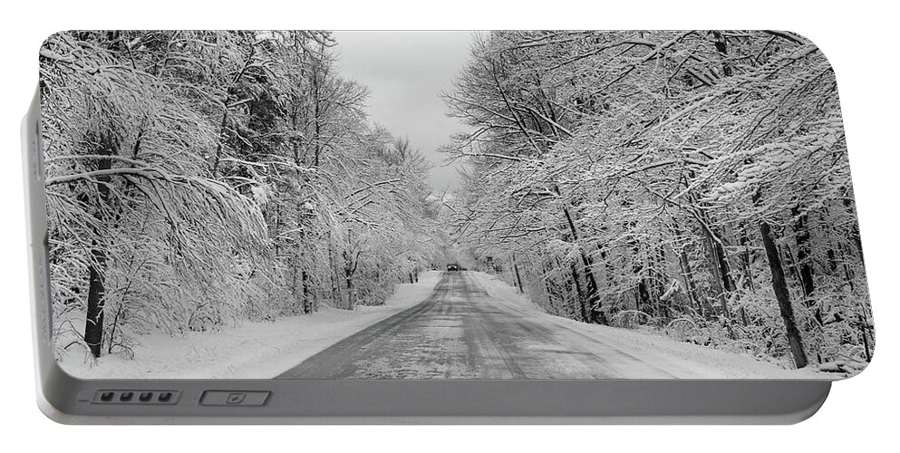 Back Road Portable Battery Charger featuring the photograph Traveling Through the Fresh Snow by David T Wilkinson