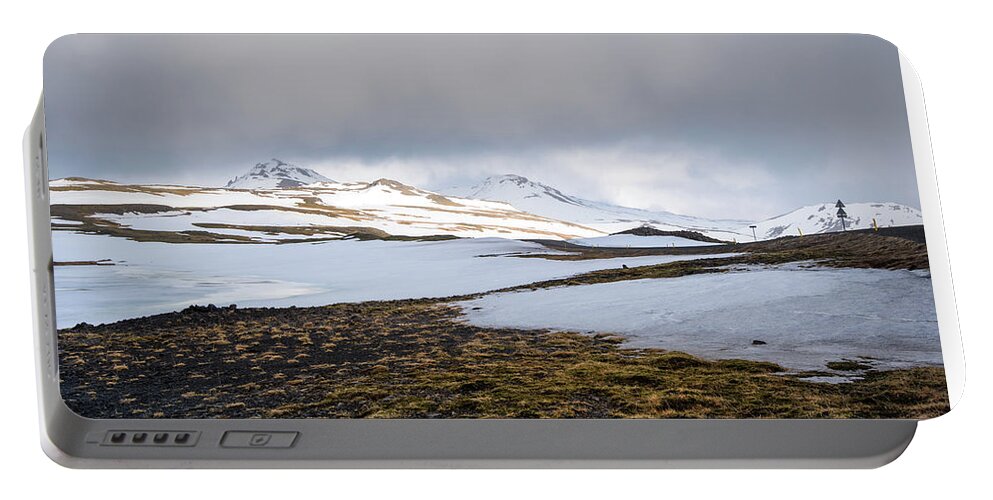 Iceland Portable Battery Charger featuring the photograph Icelandic landscape with mountains and meadow land covered in snow. Iceland by Michalakis Ppalis