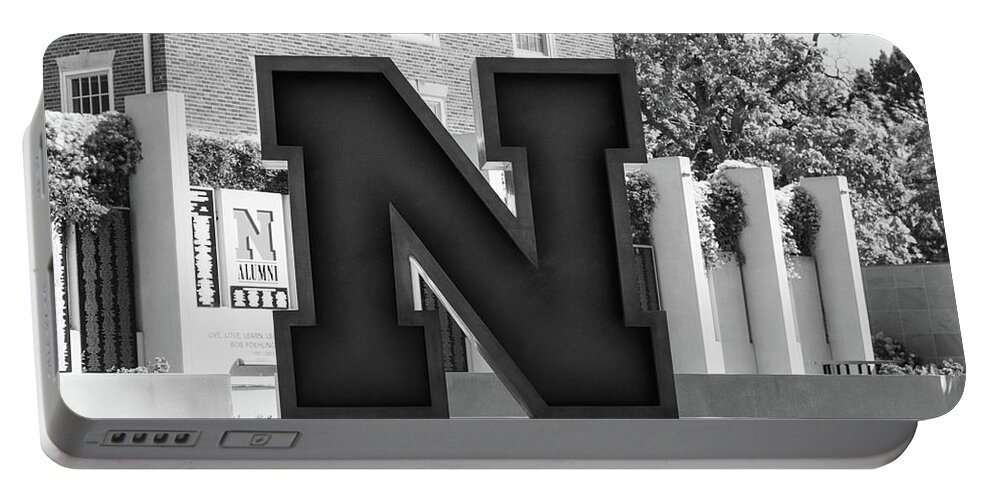 College Campus Tour Portable Battery Charger featuring the photograph Large Red N statue at the University of Nebraska in black and white #1 by Eldon McGraw