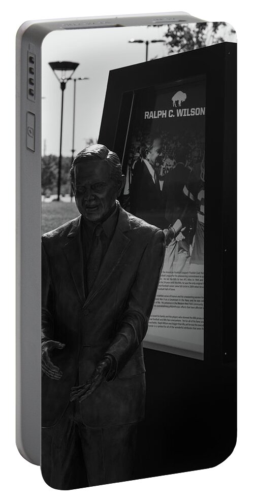 Buffalo New York Portable Battery Charger featuring the photograph Ralph Wilson statue at Buffalo Bills Stadium in black and white by Eldon McGraw
