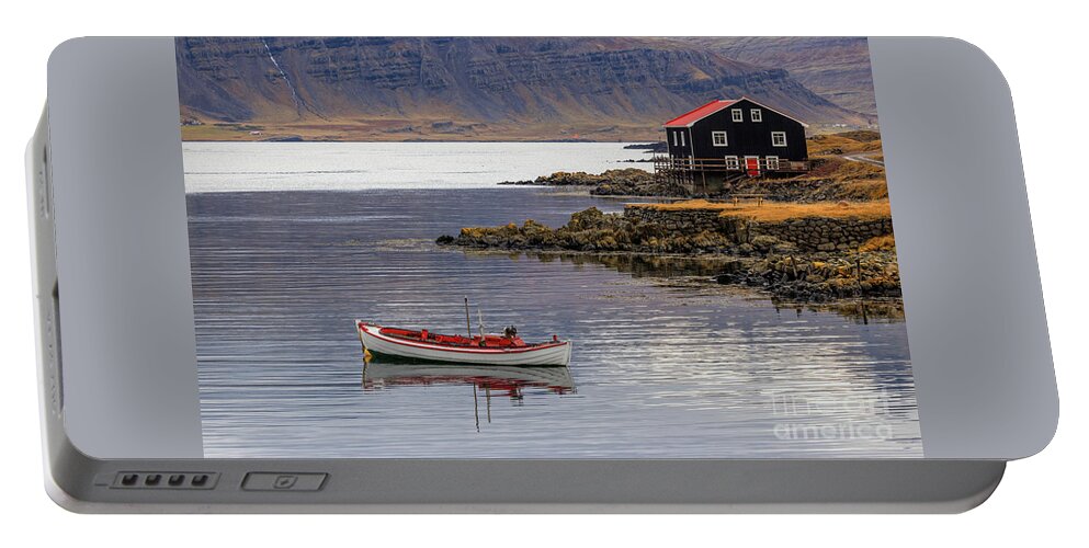Iceland Portable Battery Charger featuring the photograph Small boat and black wooden house, Djupivogur, Eastfjords, Icela #1 by Jane Rix