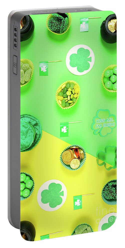 St Patrick Portable Battery Charger featuring the photograph St Patrick's Day flat lay with chocolate coins, leprechaun hat and shamrocks. #1 by Milleflore Images