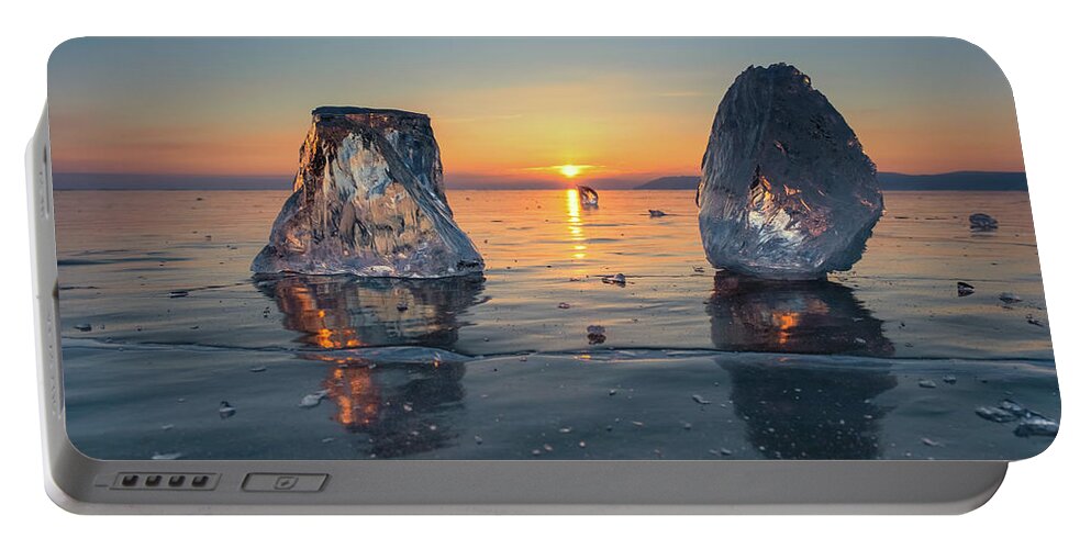Ice Portable Battery Charger featuring the photograph Sunset on frozen Lake Baikal #1 by Mikhail Kokhanchikov