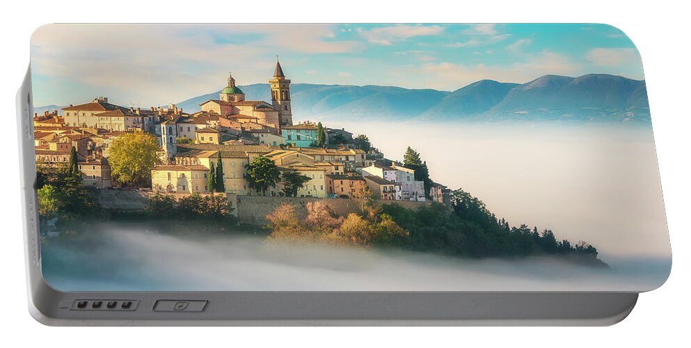 Trevi Portable Battery Charger featuring the photograph Trevi picturesque village in a foggy morning. Perugia, Umbria, I by Stefano Orazzini